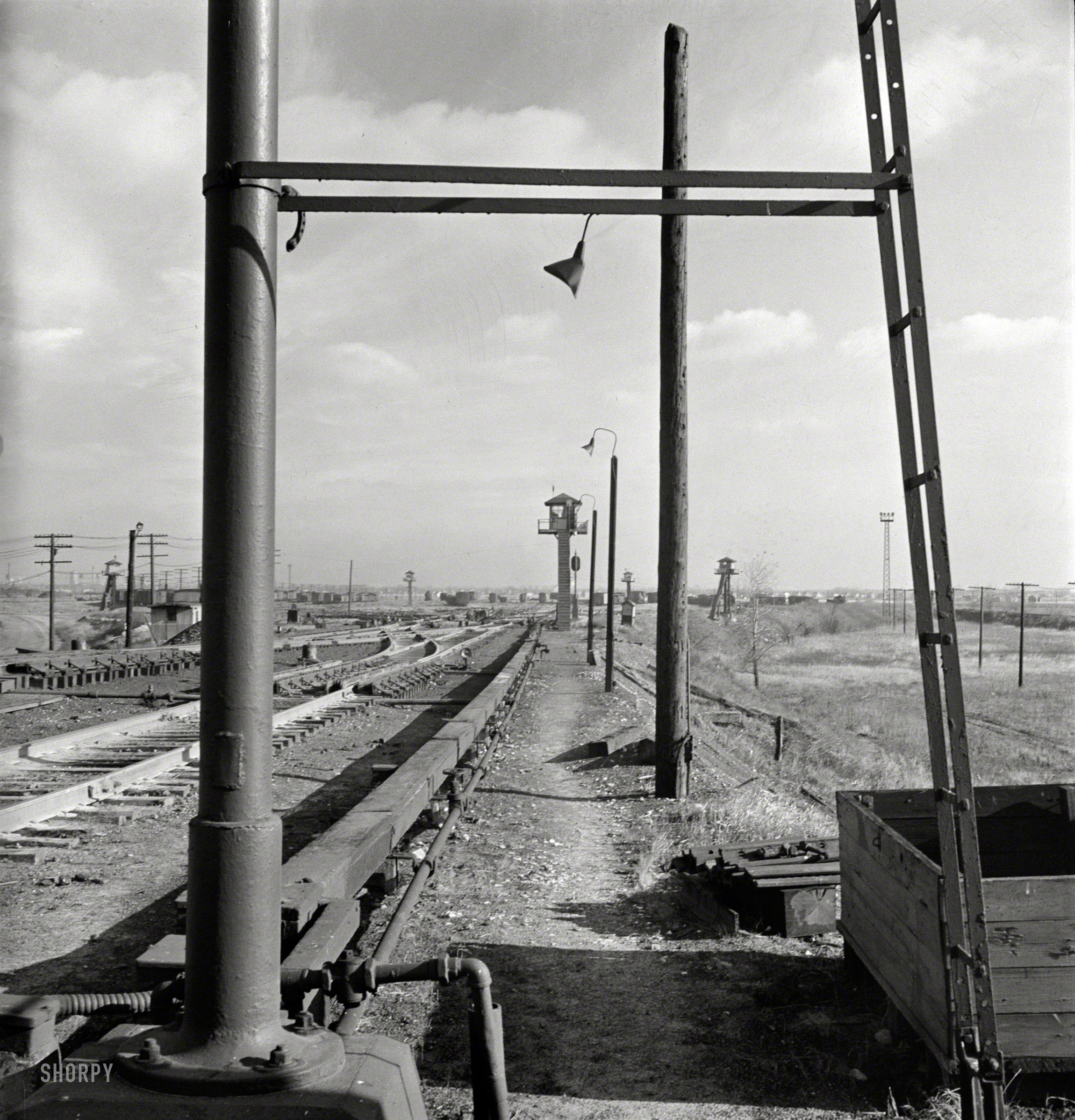 November 1942. "Chicago. Looking toward the north classification yard and retarder operator's tower at an Illinois Central railroad yard." Medium-format negative by Jack Delano for the Office of War Information. View full size.