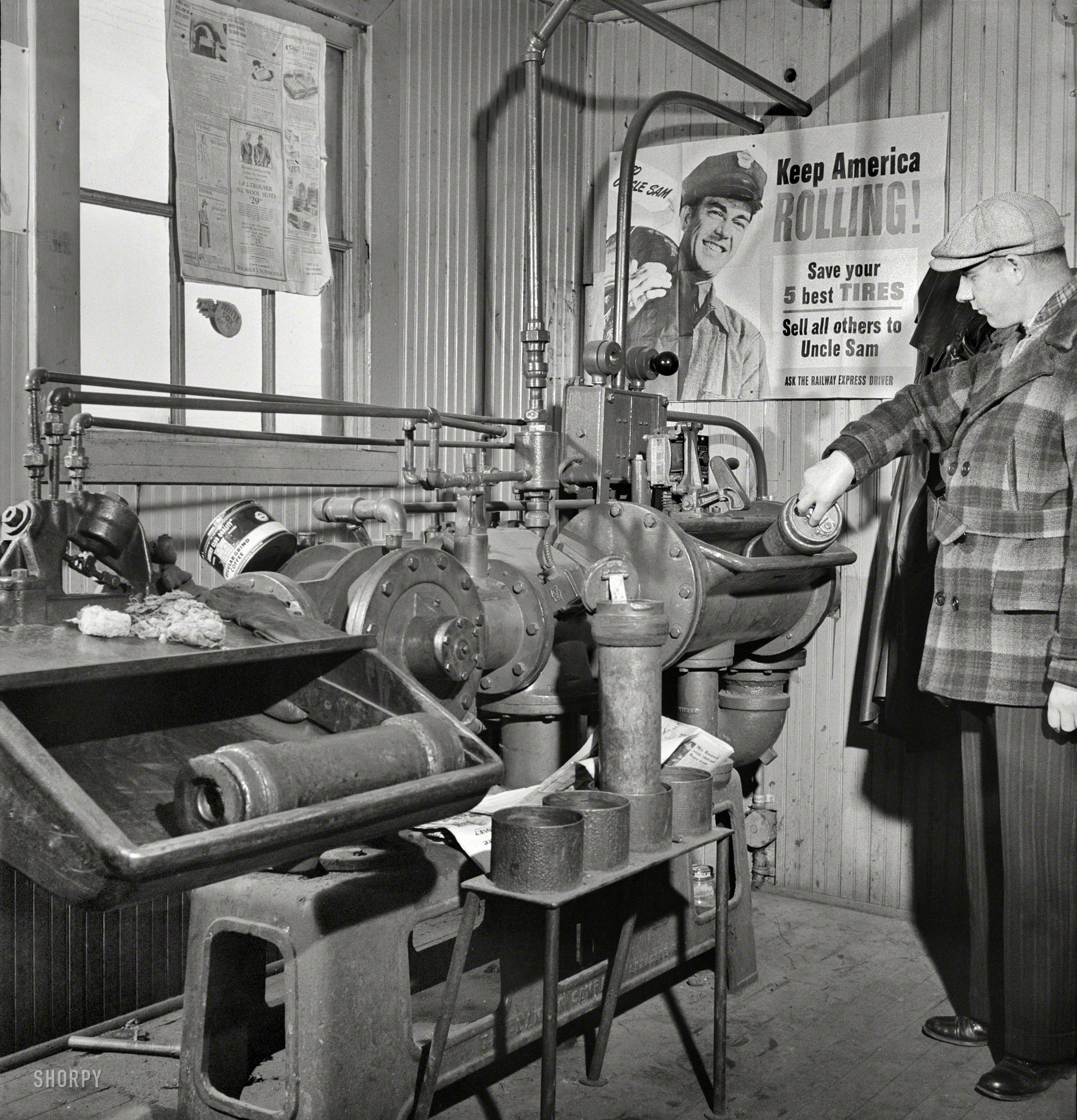 November 1942. "Chicago, Illinois. These pneumatic tubes in the Illinois Central Railroad yardmaster's office connect him with the general office." Medium-format negative by Jack Delano for the Office of War Information. View full size.