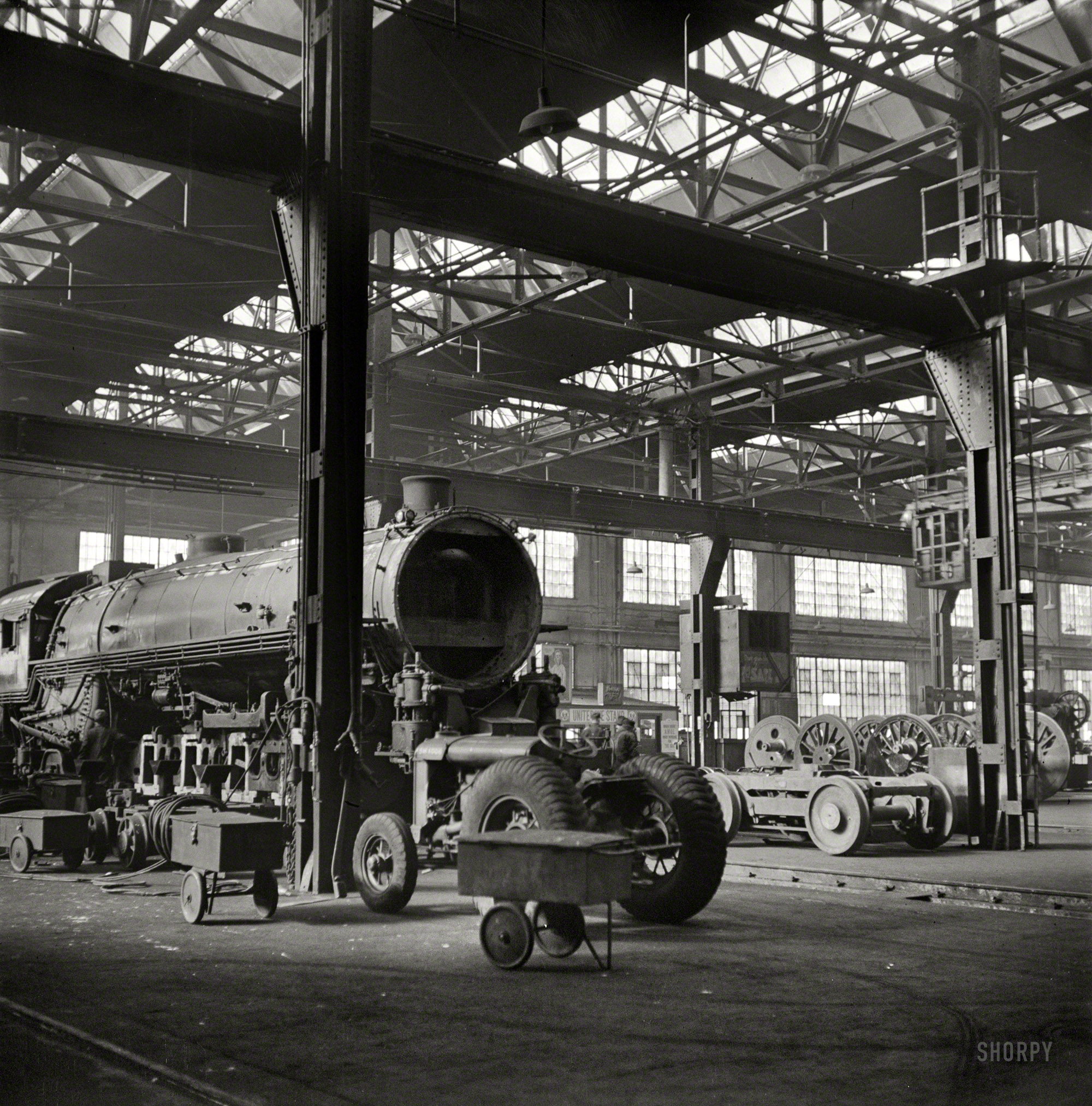 November 1942. "Illinois Central rail yard, Chicago. Locomotives in for repair at the roundhouse." Medium format negative by Jack Delano. View full size.