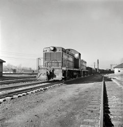 November 1942. "Chicago, Illinois. Giant diesel-electric locomotive at Illinois Central rail yard." The safety message comes to us courtesy of Engine 9205A. Photo by Jack Delano, Office of War Information. View full size.
