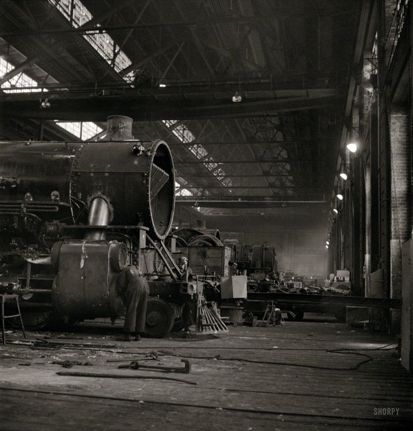 December 1942. "Chicago, Illinois. Working on a locomotive at the Chicago &amp; North Western Railroad repair shops." Photo by Jack Delano. View full size.
