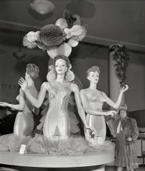 December 1942. "New York. Corset display at R.H. Macy & Co. department store during the week before Christmas." Behold the $12.29 "average figure" corselette. Photo by Marjory Collins for the Office of War Information. View full size.