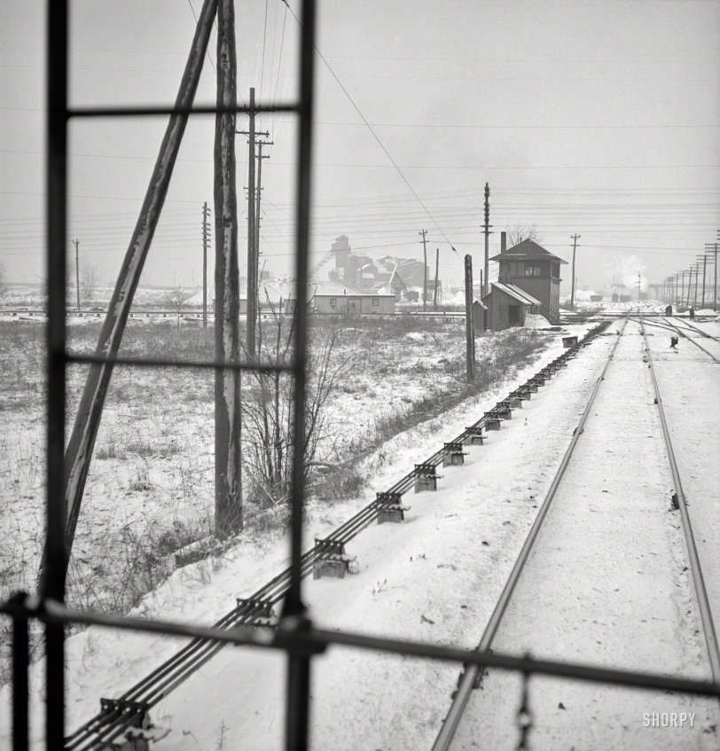 January 1943. "Freight operations on the Indiana Harbor Belt railroad between Chicago and Hammond, Indiana. The train passes many interlocking towers on the way and the conductor watches them for any special messages." Medium-format negative by Jack Delano, Office of War Information. View full size.
