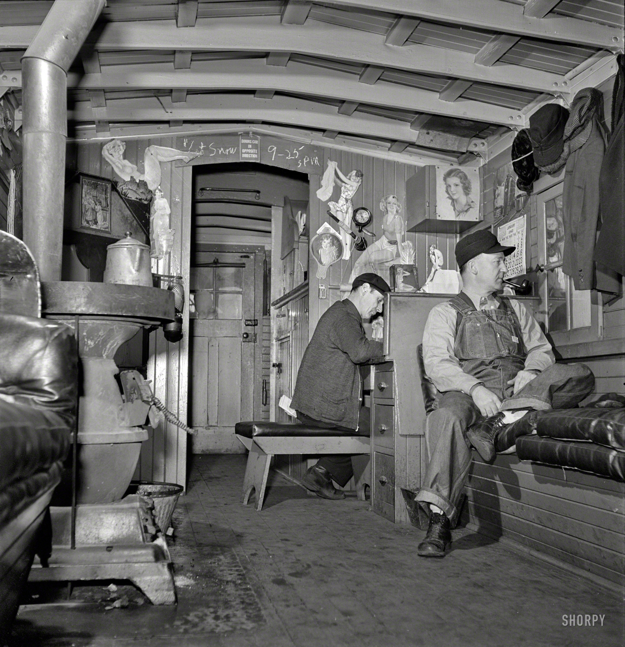 January 1943. "Freight train operations on the Chicago & North Western Railroad between Chicago and Clinton, Iowa. The caboose is the conductor's second home. He always uses the same one and many conductors cook and sleep there while waiting for trains to take back from division points." Medium-format negative by Jack Delano for the Office of War Information. View full size.