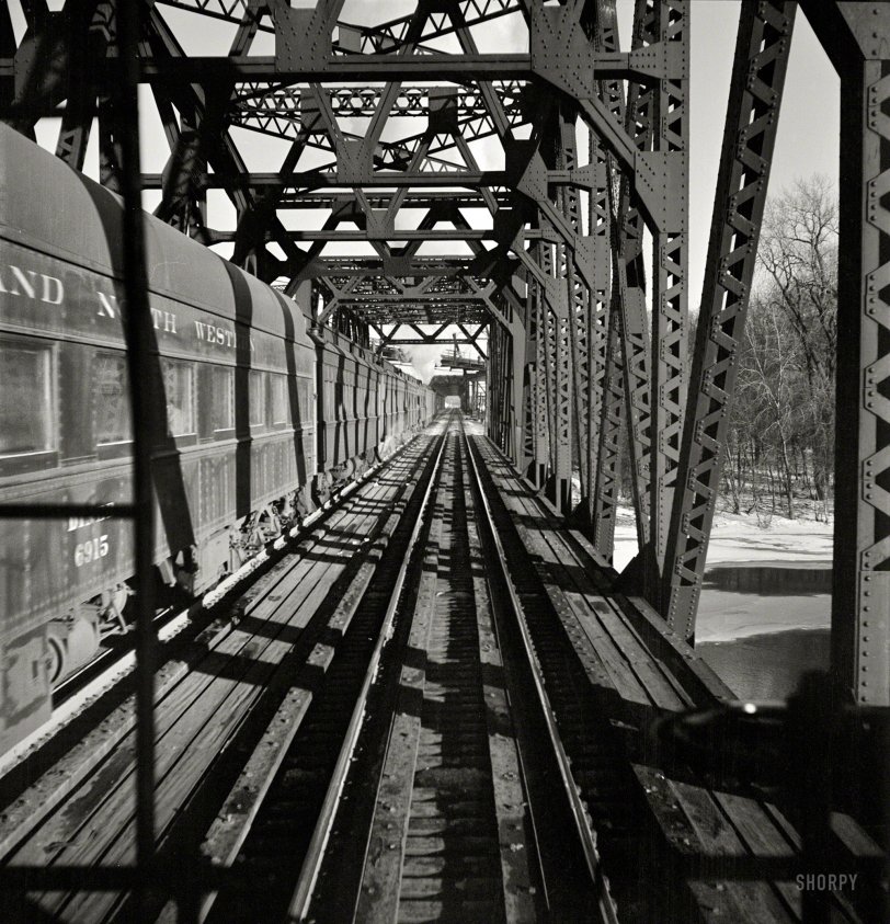 January 1943. "Freight operations on the Chicago &amp; North Western R.R. between Chicago and Clinton, Iowa. The train crosses a long steel bridge." Medium-format negative by Jack Delano for the Office of War Information. View full size.
