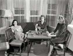 Detroit, summer 1941. Our third look at a series of photos taken by Arthur Siegel for the Office of War Information. The first few are labeled "Girls playing cards and drinking Coca-Cola." Then the caption disappears, and the rest of the photos bear the notation "This image in jacket marked 'killed'."  View full size.
