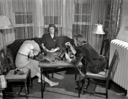 &nbsp; &nbsp; &nbsp; The next entry in this curious series of photos from the Office of War Information archive, taken by Arthur Siegel in the summer of 1941 in Detroit. We're now well into the subset of pictures bearing the notation "This image in jacket marked 'Killed'."
"Detroit, Michigan. Girls playing cards and drinking Coca-Cola." View full size.