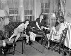 Detroit, summer 1941. "Girls playing cards and drinking Coca-Cola." The card table seems to have turned in this seventh installment of Arthur Siegel's mysterious photos for the Office of War Information. View full size.