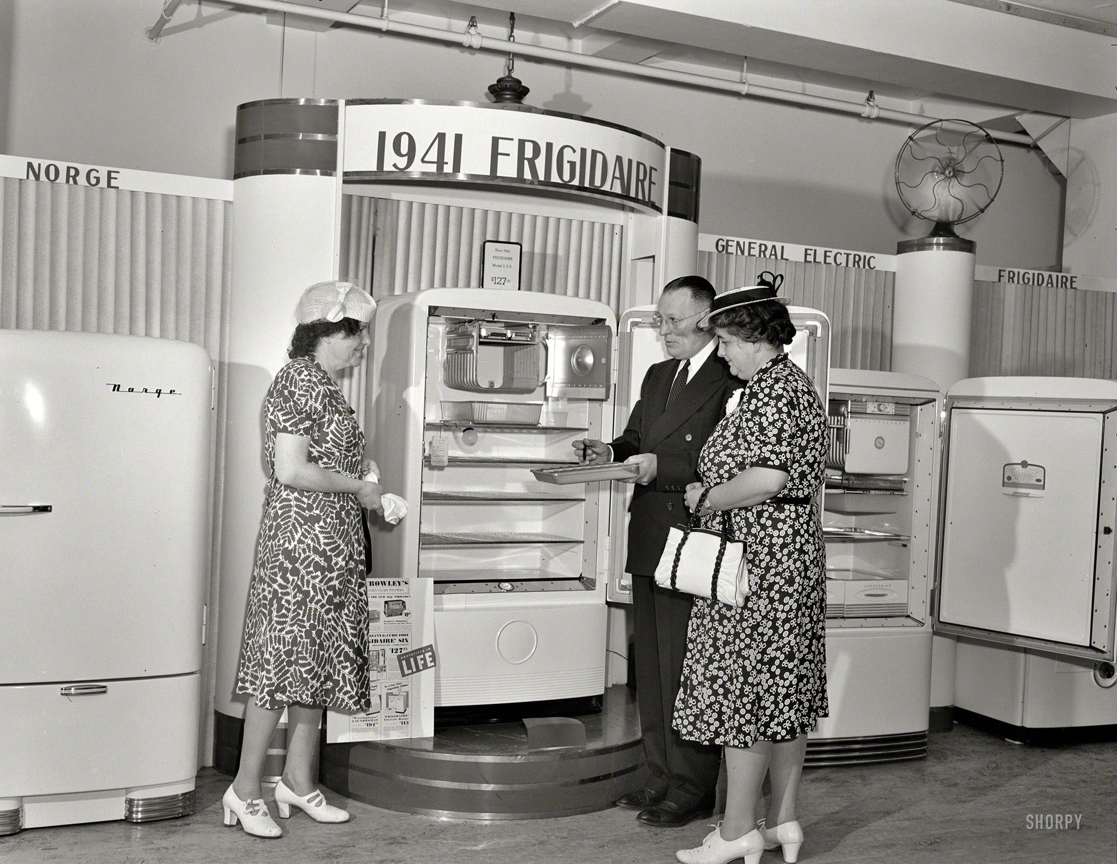 July 1941. "Detroit, Michigan. Buying a refrigerator at the Crowley-Milner department store." Here we see Mr. Salesman explaining the ice maker, which employs a "tray." Large-format negative by Arthur S. Siegel. View full size.