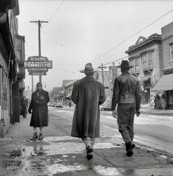 February 1942. "Detroit, Michigan. Back view of a Negro dressed in a zoot suit, walking in the business district." Medium-format nitrate negative by Arthur Siegel for the Office of War Information. View full size.