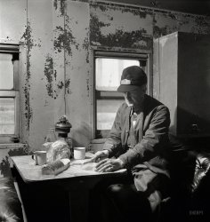 March 1943. "Conductor George E. Burton, having lunch in the caboose on the Atchison, Topeka & Santa Fe between Chicago and Chillicothe." Medium-format negative by Jack Delano for the Office of War Information. View full size.