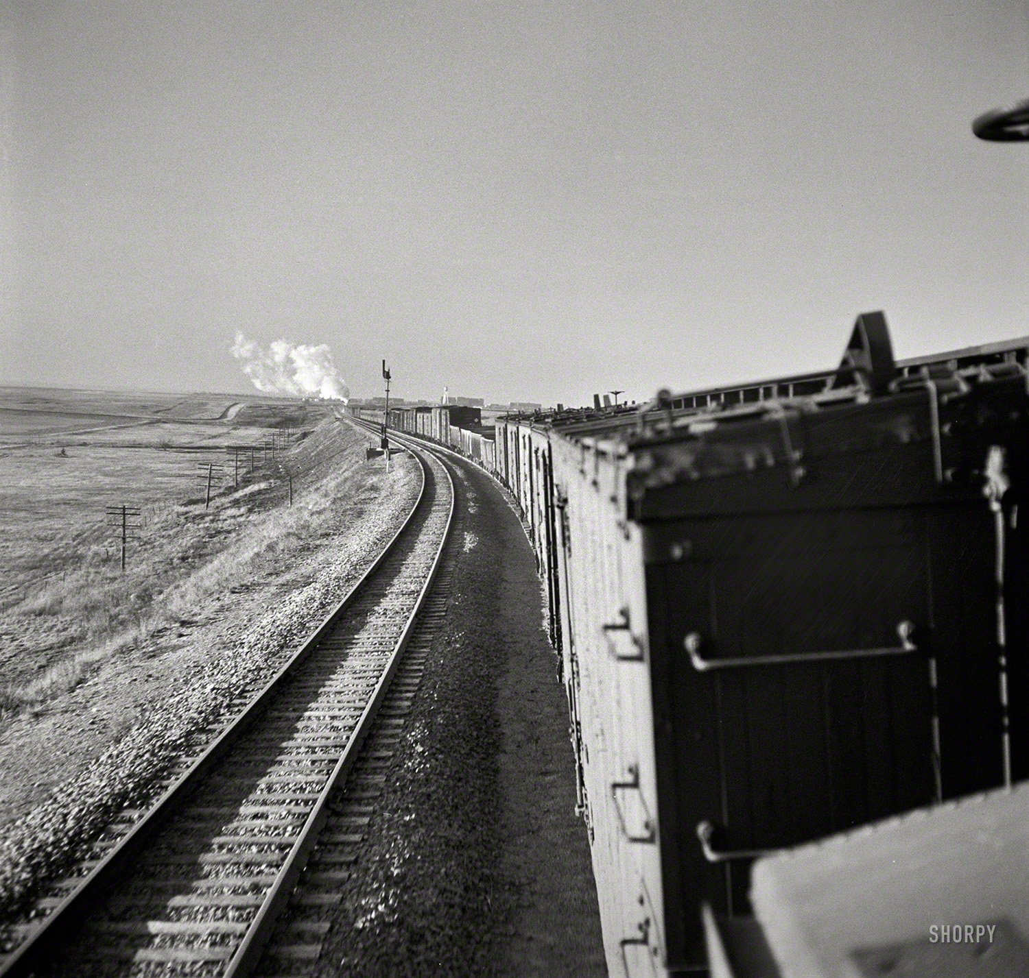 March 1943. "Canyon, Texas. Approaching the town on the Atchison, Topeka & Santa Fe Railroad between Amarillo, Texas, and Clovis, New Mexico." One of hundreds of photos documenting Jack Delano's trip from Chicago to California on a Santa Fe freight for the Office of War Information. View full size.