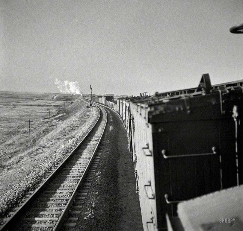 March 1943. "Canyon, Texas. Approaching the town on the Atchison, Topeka &amp; Santa Fe Railroad between Amarillo, Texas, and Clovis, New Mexico." One of hundreds of photos documenting Jack Delano's trip from Chicago to California on a Santa Fe freight for the Office of War Information. View full size.
