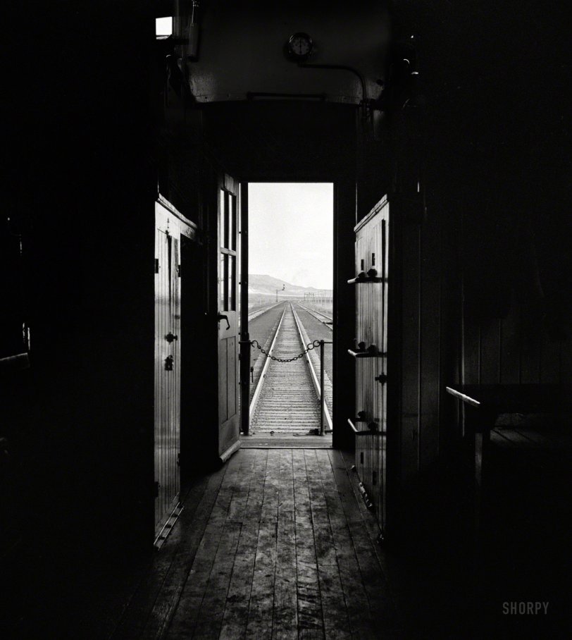 March 1943. "View from caboose on the Atchison, Topeka & Santa Fe Railroad between Belen and Gallup, New Mexico." Next stop, Infinity. Medium-format negative by Jack Delano for the Office of War Information. View full size.