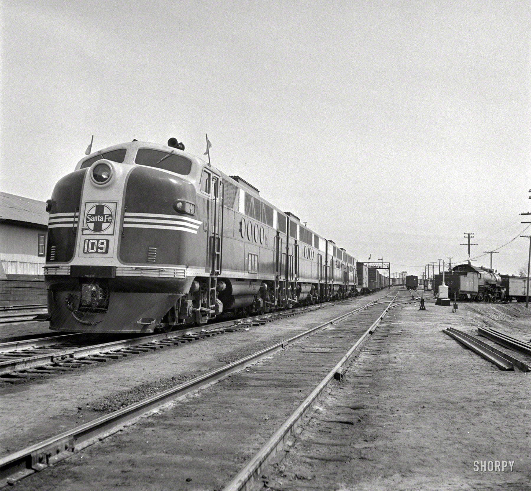 March 1943. "Flagstaff, Arizona. Diesel locomotive entering town along the Atchison, Topeka & Santa Fe Railroad between Winslow and Seligman." Photo by Jack Delano for the Office of War Information. View full size.