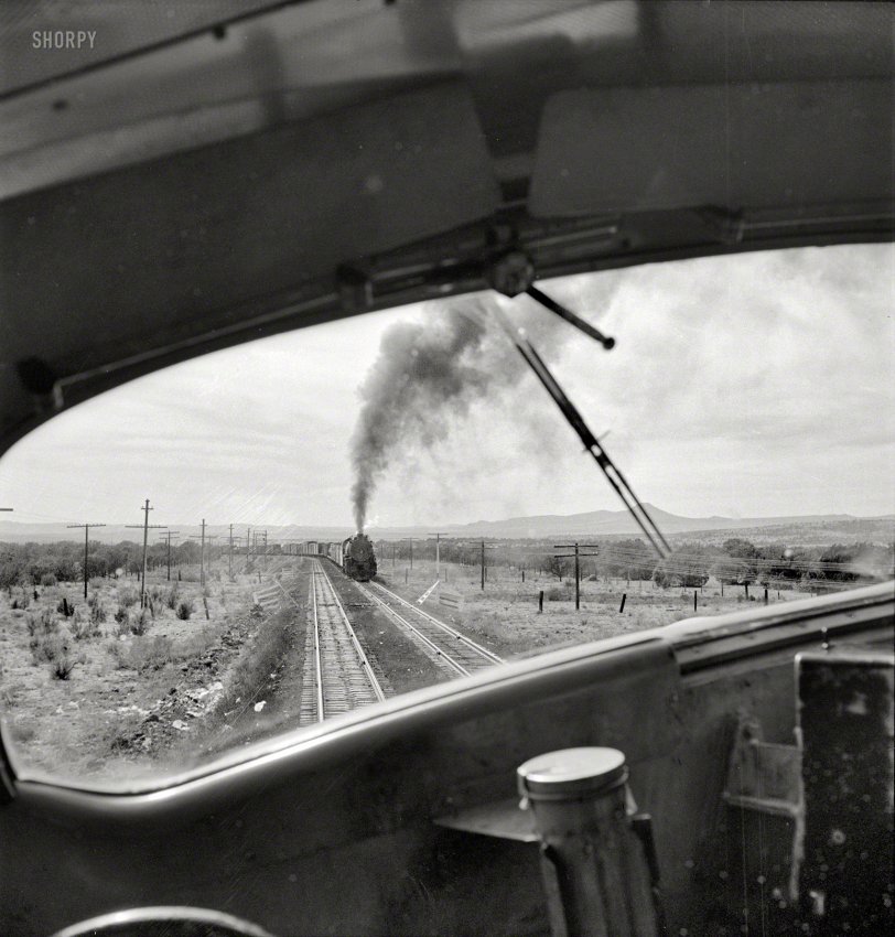 March 1943. "Ash Fork, Arizona (vicinity). Passing an eastbound freight on the Atchison, Topeka &amp; Santa Fe Railroad between Winslow and Seligman." Medium-format negative by Jack Delano, Office of War Information. View full size.
