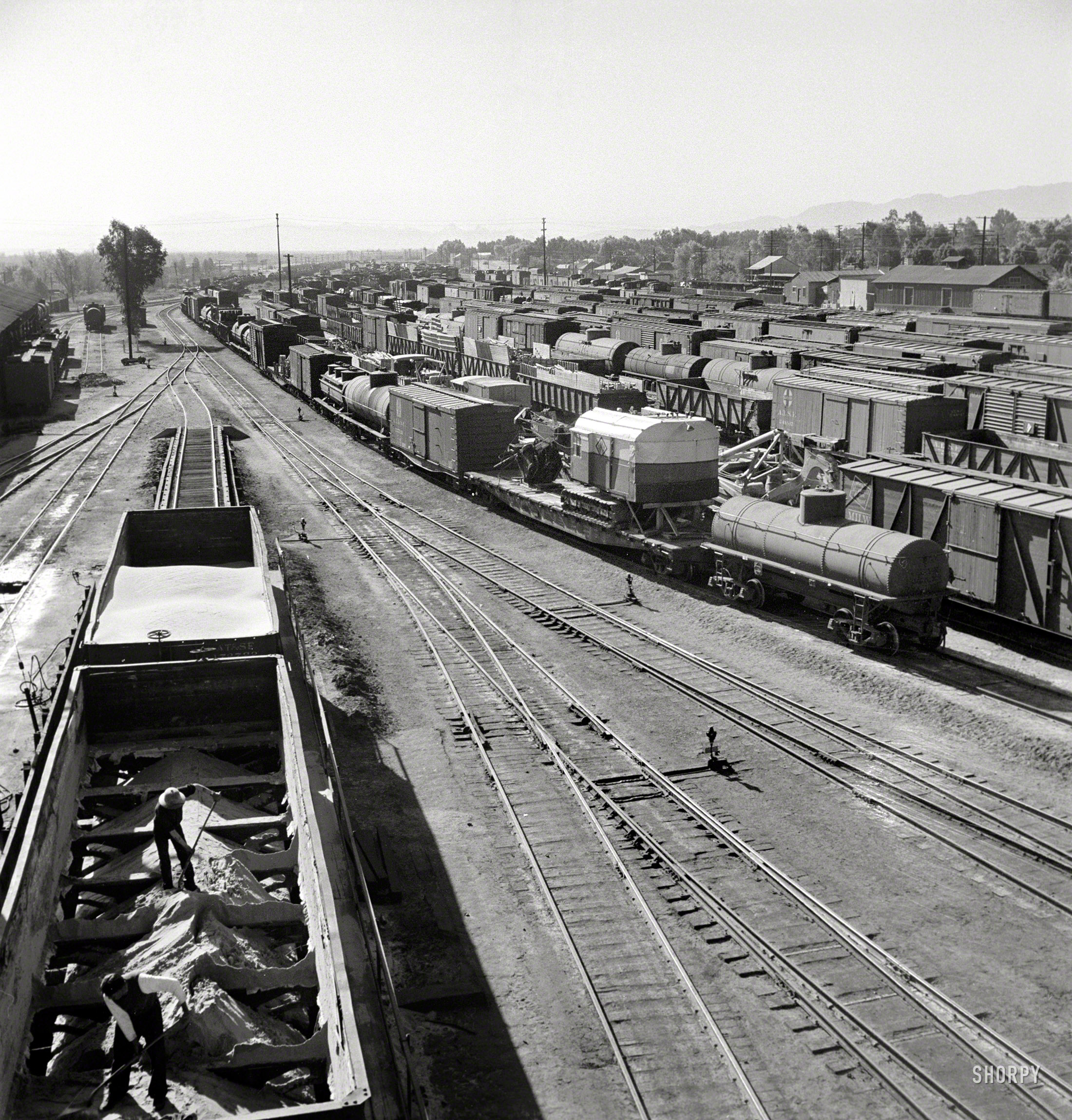 March 1943. "Needles, California. A general view of the Atchison, Topeka & Santa Fe rail yard." Photo by Jack Delano, Office of War Information. View full size.
