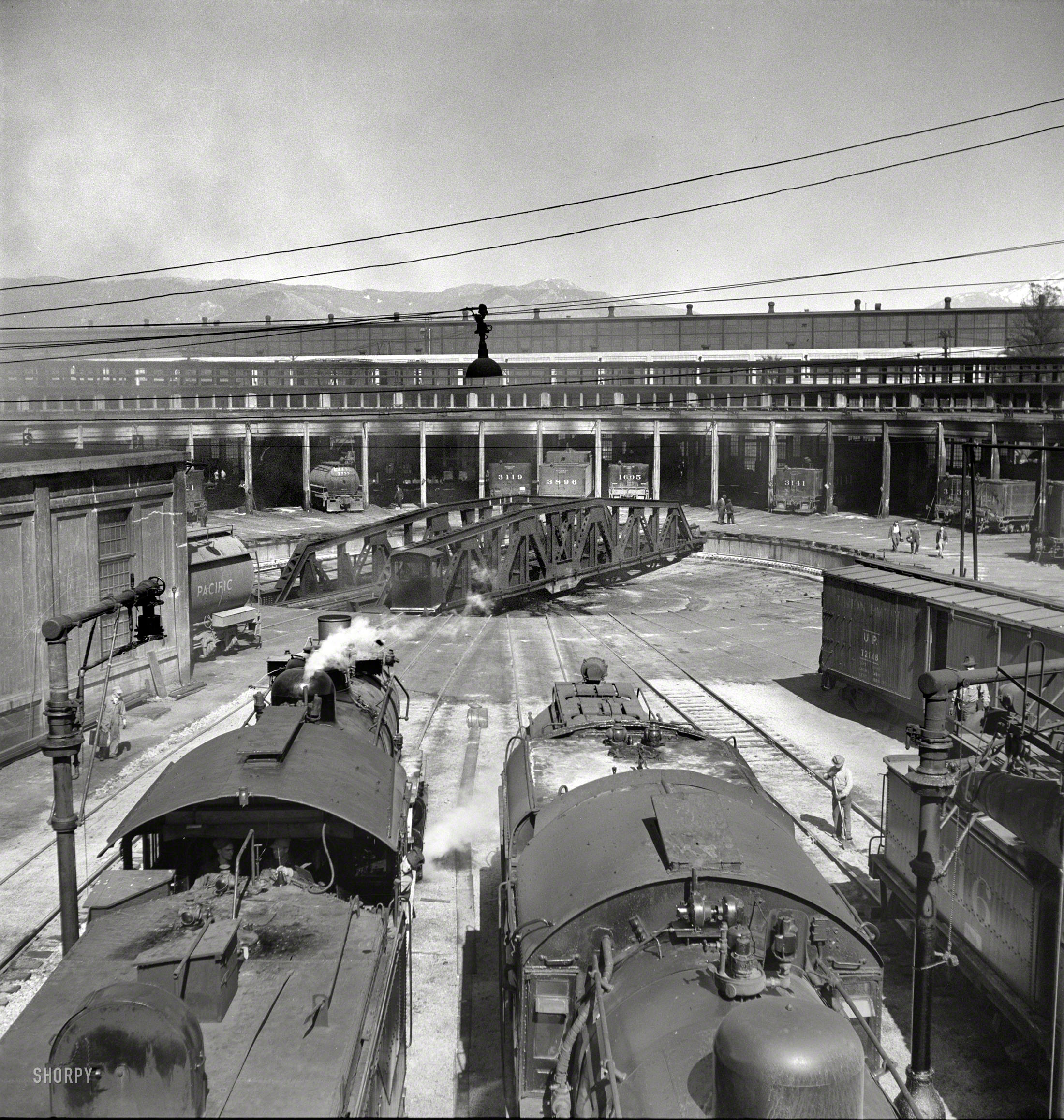March 1943. "San Bernardino, Calif. Engines at the roundhouse." Medium-format negative by Jack Delano for the Office of War Information. View full size.