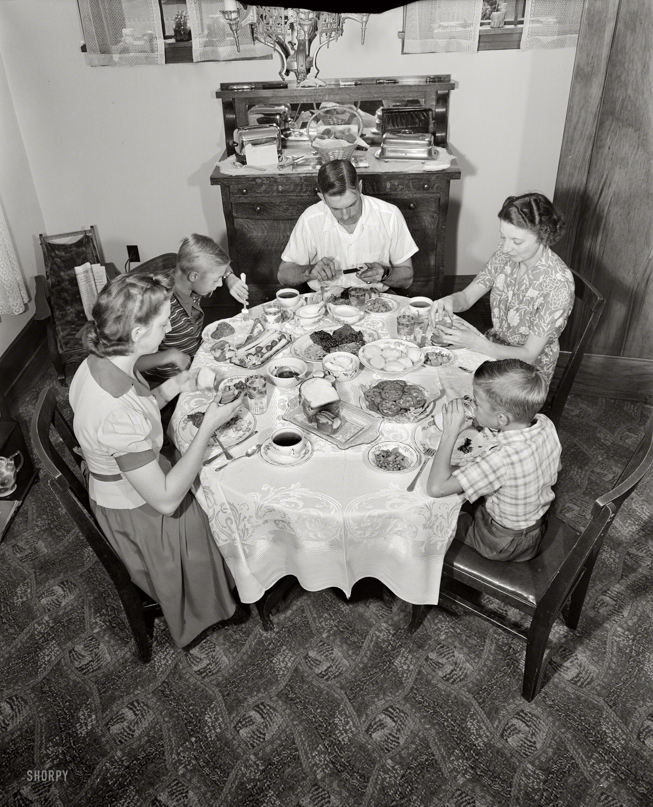 September 1942. Rochester, New York. "The Babcocks at the dinner table." Continuing the saga of war worker Howard Babcock and his family. Large-format negative by Ralph Amdursky for the Office of War Information. View full size.