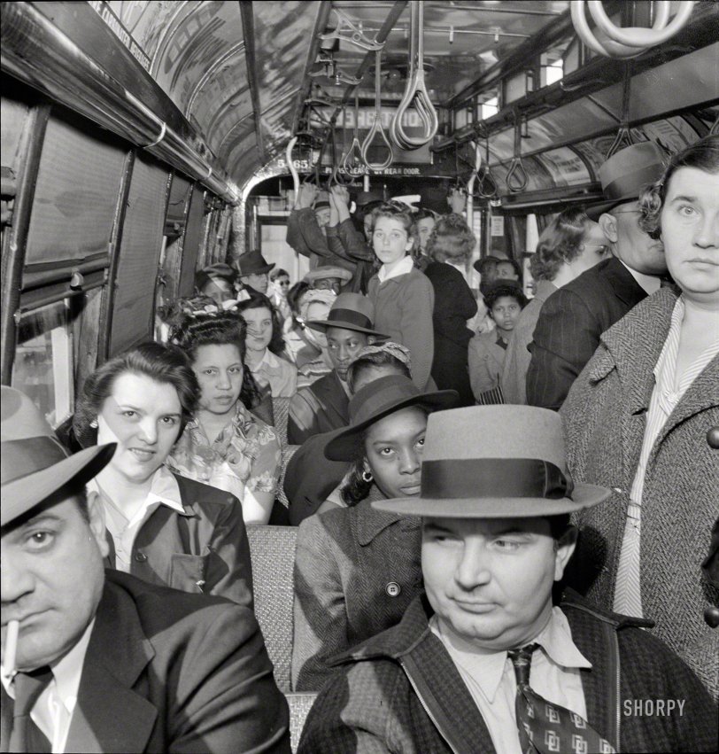 April 1943. "Baltimore, Maryland. Students and workers returning home on a trolley at 5 p.m." Please leave by rear door! Medium format nitrate negative by Marjory Collins for the Office of War Information. View full size.
