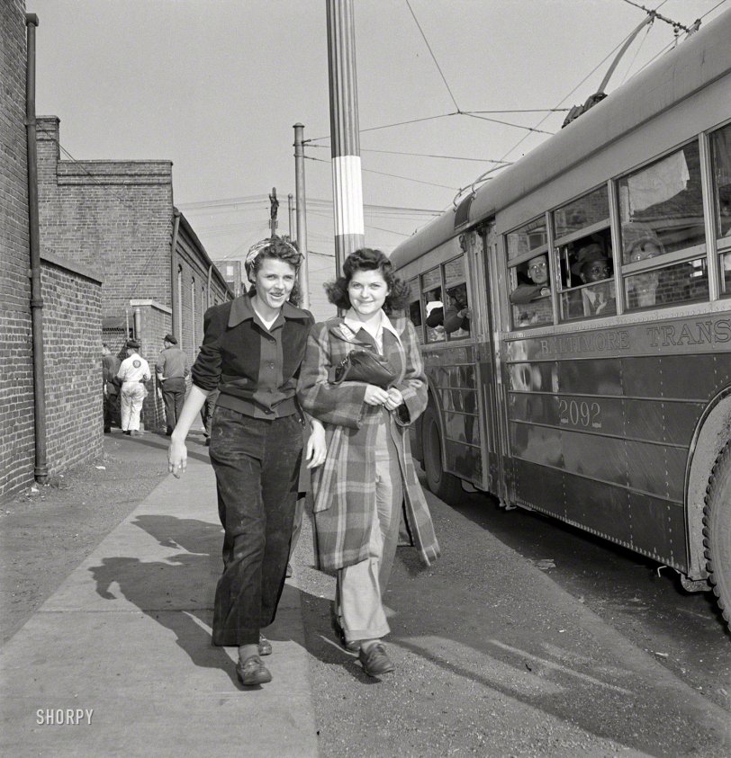 April 1943. "Baltimore, Maryland. Rushing to catch the trackless trolley home from work at 4 p.m." Basically an electric bus. Medium format nitrate negative by Marjory Collins for the Office of War Information. View full size.
