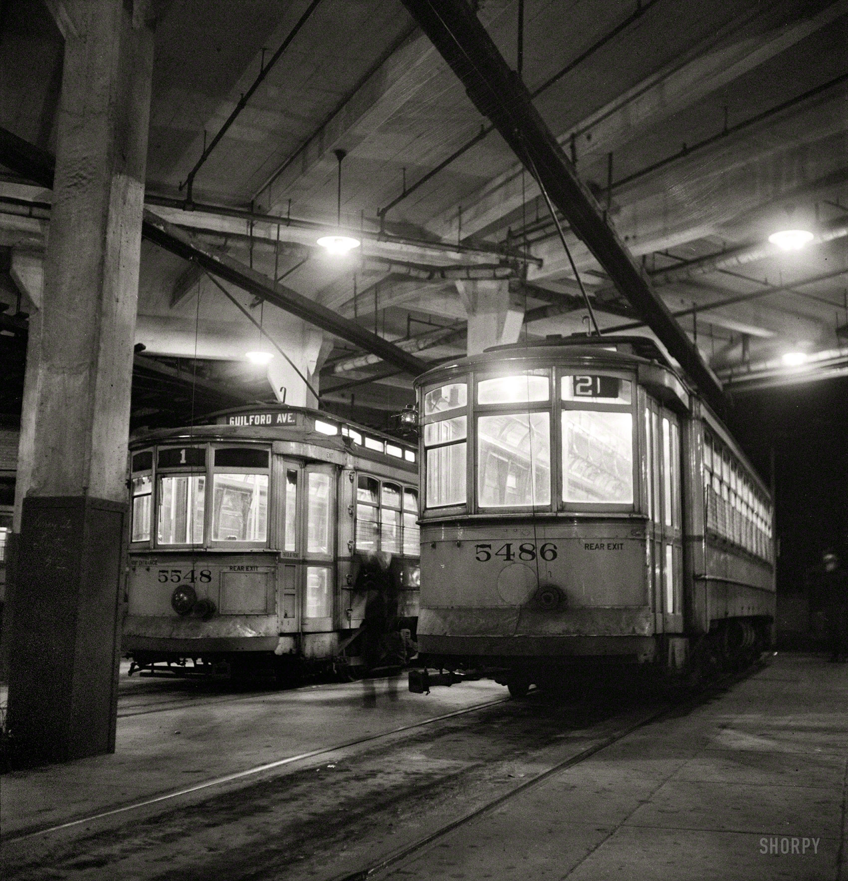 April 1943. "Baltimore, Maryland. Trolleys inside the Park Terminal at night." Photo by Marjory Collins for the Office of War Information. View full size.