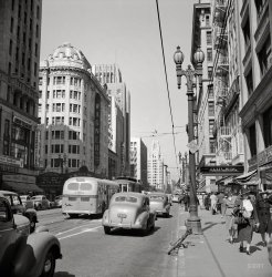 April 1942. "South Hill Street, Los Angeles." Now playing at the Warner: The Male Animal. Photo by Russell Lee for the Office of War Information. View full size.