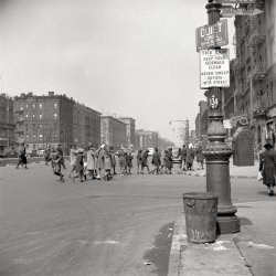 New York, May-June 1943. "Many accidents are attributed to unpatrolled intersections in Harlem. Here schoolchildren are allowed to run across busy intersections unescorted." Photo by Gordon Parks for the OWI. View full size.