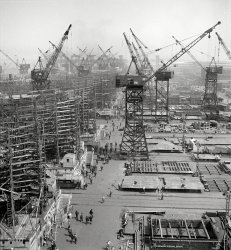 May 1943. "Bethlehem-Fairfield shipyards, Baltimore. 'Liberty ship' cargo transports." Photo by Arthur Siegel, Office of War Information. View full size.