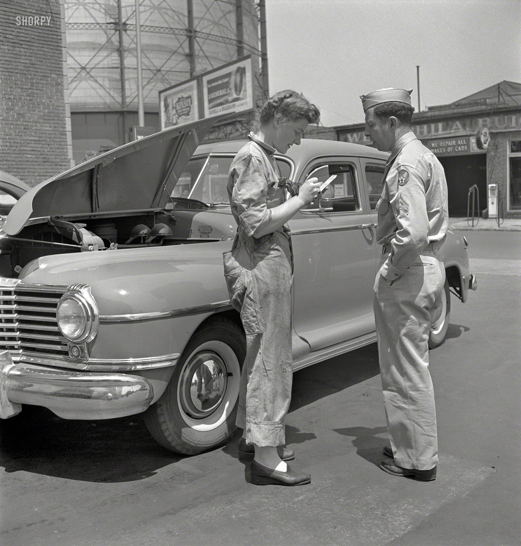 June 1943. "Philadelphia, Pennsylvania. Miss Frances Heisler (last seen here), attendant at one of the Atlantic Refining Company garages. She was formerly a clerk in the payroll department of the Curtis Publishing Company." Photo by Jack Delano for the Office of War Information. View full size.
