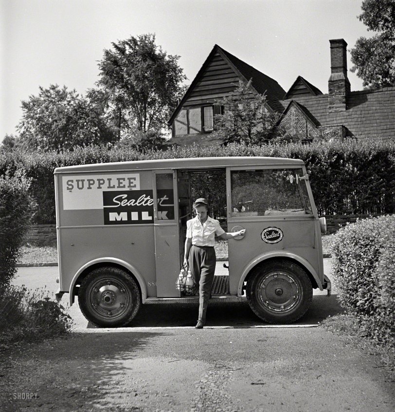 June 1943. Bryn Mawr, Pa. Our second visit with Mrs. Helen Joyce, "one of the many women who now work for the Supplee-Wills-Jones Milk Co." Piloting a little Walker electric delivery van. Photo by Jack Delano. View full size.
