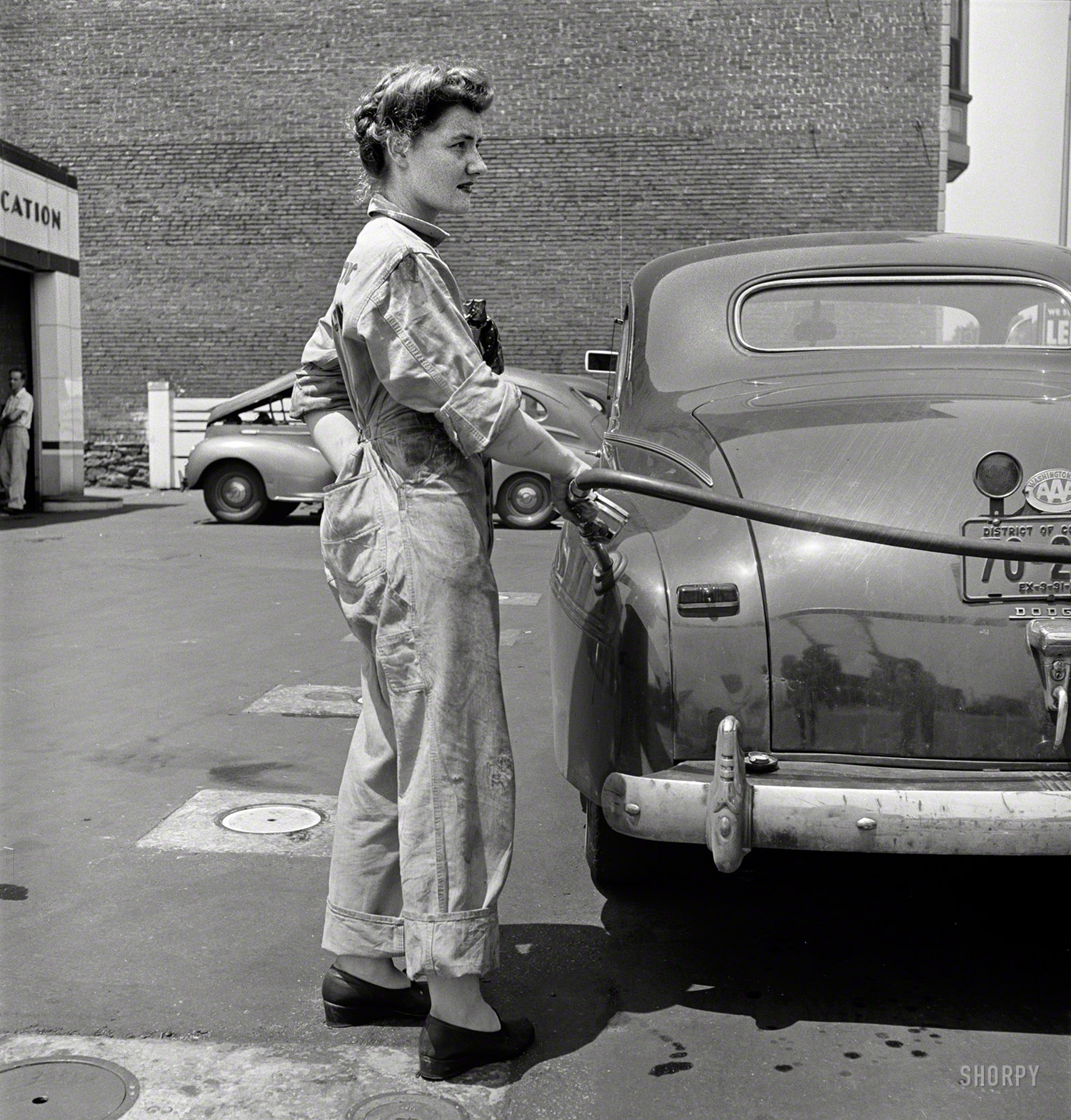 June 1943. "Miss Frances Heisler, pump attendant at one of the Atlantic Refining Company garages in Philadelphia. She was formerly a clerk in the payroll department of the Curtis Publishing Co." Our third look at Frances on the job. Photo by Jack Delano for the Office of War Information. View full size.