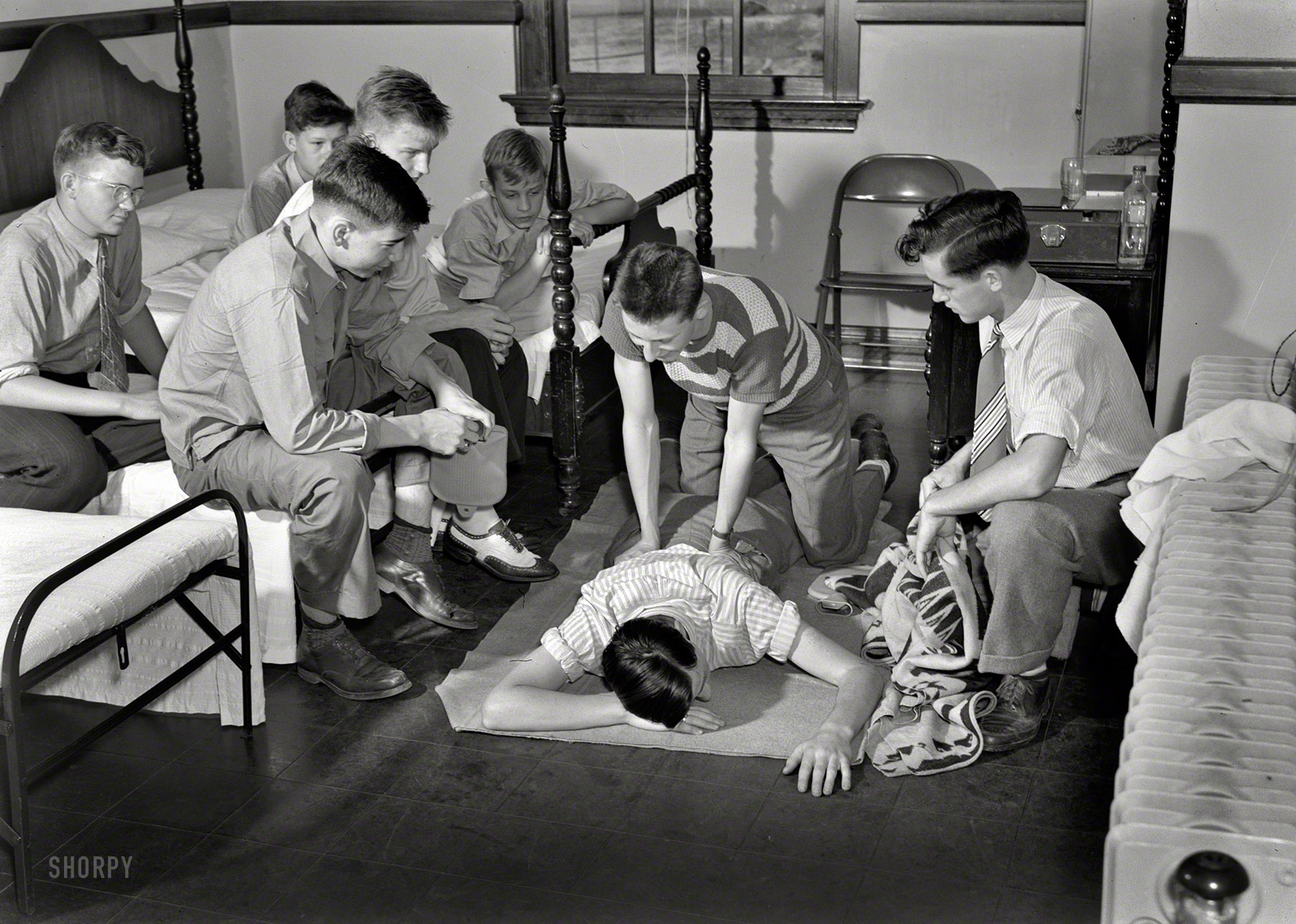 June 1943. "Keysville, Virginia. Randolph Henry High School. First aid group in school dispensary." Does the post-secondary version of this course involve beer? Photo by Philip Bonn for the Office of War Information. View full size.