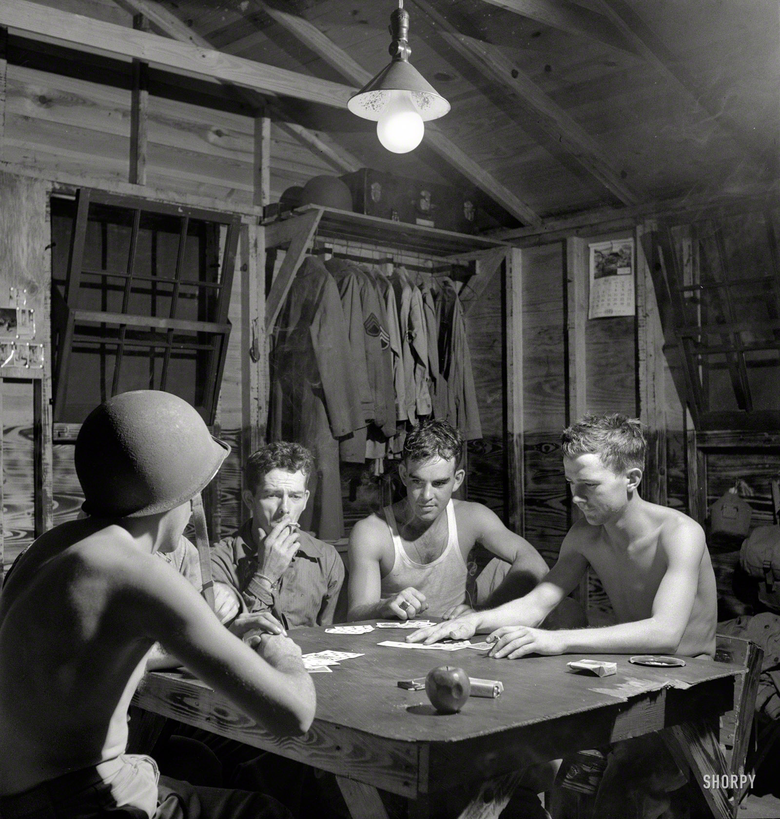 July 1943. Greenville, South Carolina. "Air Service Command. Men of the Quartermaster Truck Company of the 25th Service Group having a card game in one of the barracks." Stag counterpoint to the girls back home. Photo by Jack Delano for the Office of War Information. View full size.