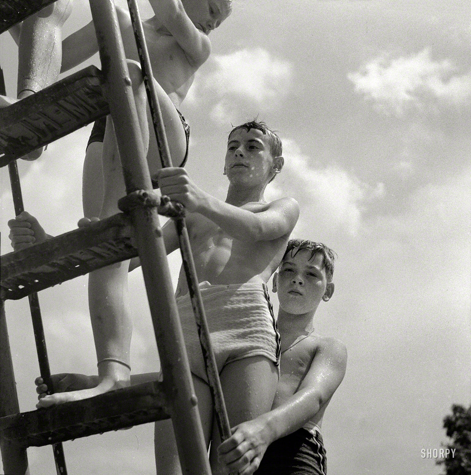 Future Olympic Sliding hopefuls.

July 1943. "Glen Echo, Maryland. Climbing the ladder to the sliding board at the Glen Echo swimming pool." Photo by Esther Bubley. View full size.
