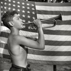 August 1943. "Southfields, New York. Interracial activities at Camp Nathan Hale, where children are aided by the Methodist Camp Service. Mess call." Photo by Gordon Parks for the Office of War Information. View full size.
