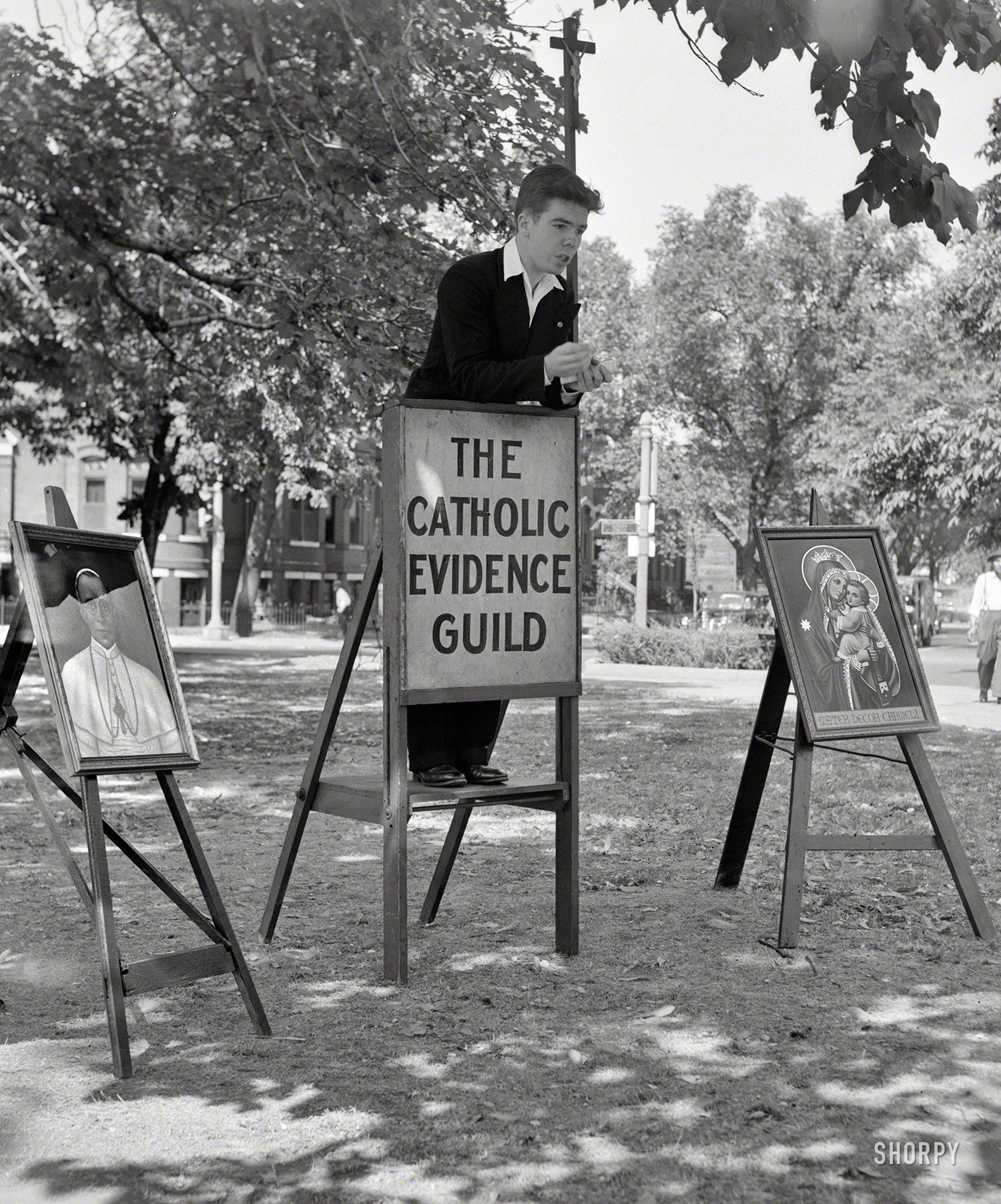July 1943. Washington, D.C. "Member of the Catholic Evidence Guild speaking in Logan Circle." Photo by Joseph Horne, Office of War Information. View full size.