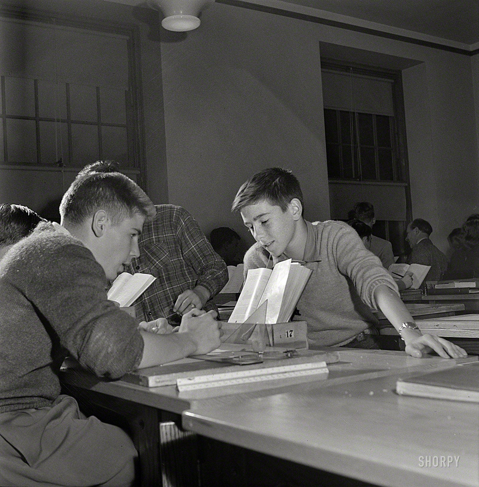 October 1943. Washington, D.C. "A mechanical drawing class at Woodrow Wilson High School." The Popular Girls making themselves scarce. Photo by Esther Bubley for the Office of War Information. View full size.
