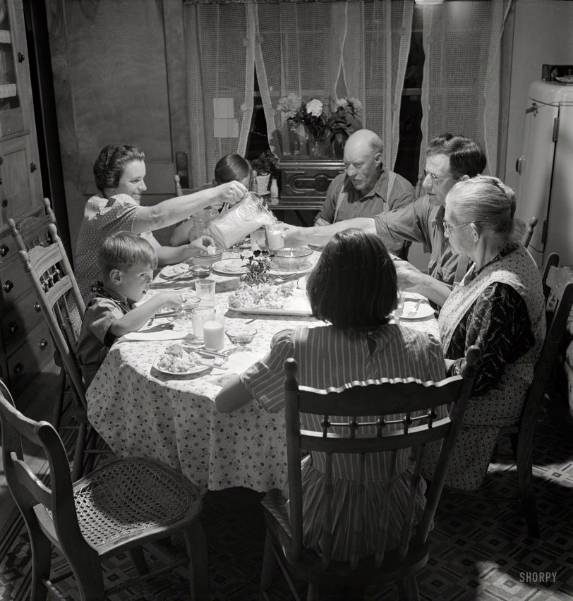 July 1942. "East Montpelier, Vermont. The Charles Ormsbee family and his widowed mother, Mrs. Myrtle Ormsbee, at dinner." Happy Thanksgiving from Shorpy! Photo by Fritz Henle for the Office of War Information. View full size.
