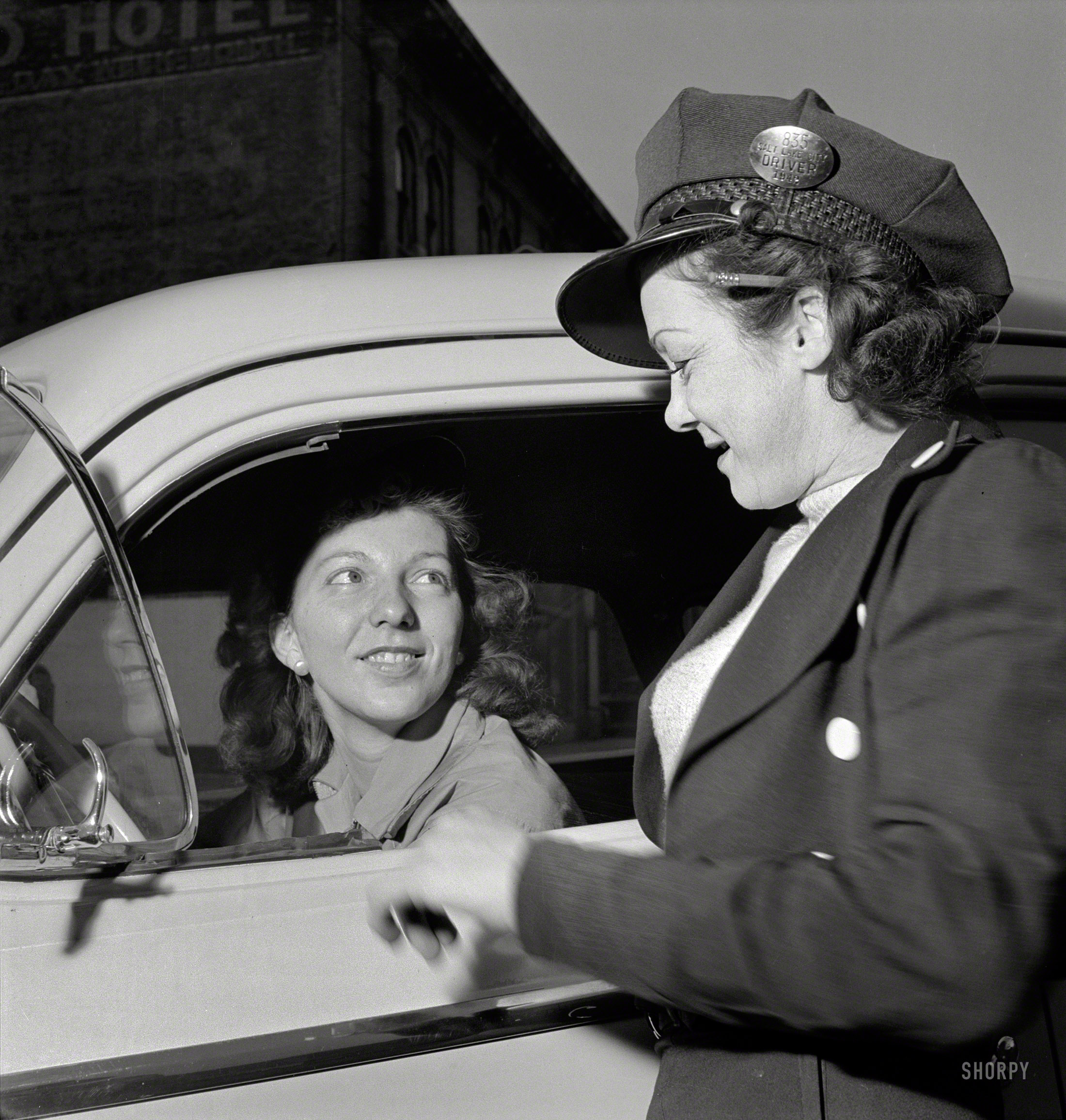 November 1942. Salt Lake City, Utah. "Training women to operate buses and taxicabs." Lesson 1: Position pencil over ear. Tip cap at jaunty angle. Crack gum. Photo by Andreas Feininger for the Office of War Information. View full size.