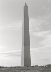 November 1943. "The Washington Monument." The "tan line" a third of the way up shows where construction resumed in the 19th century after a hiatus of many years. Photo by Esther Bubley, Office of War Information. View full size.