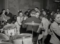 Chicago, April 1942. "Dancing to the music of Red Saunders and his band at the Club DeLisa." Photographer Jack Delano swaps the train pictures for a taste of cafe society. Med. format negative, Office of War Information. View full size.