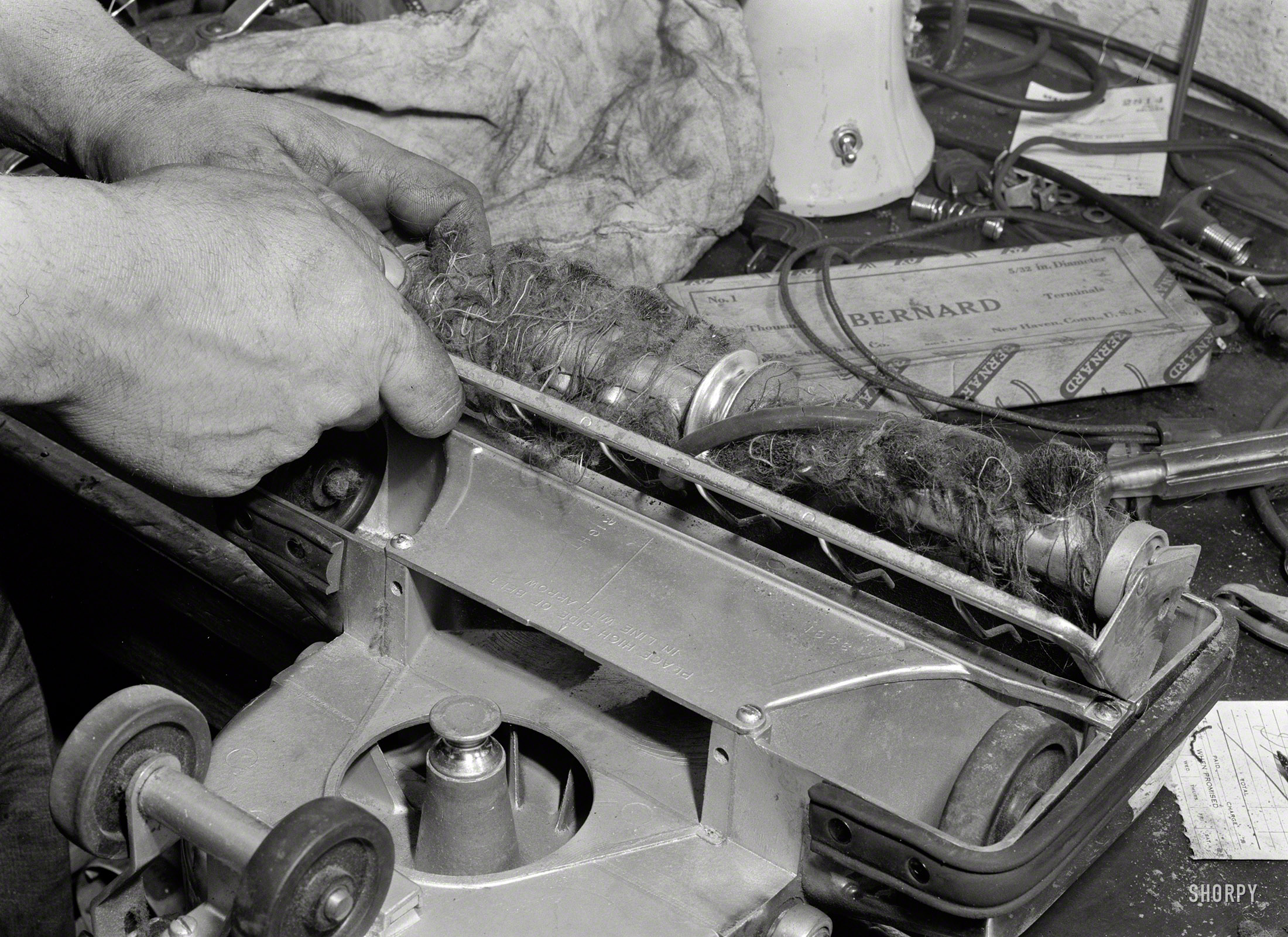 February 1942. "Portrait of a mistreated vacuum cleaner. It's in the repair shop because it inhaled bits of metal, pieces of wire, hairpins, and other harmful objects. Keep the machine away from such things, clean the brushes and belt regularly, and empty the bag at least once a week." Actually, if your Hoover looks anything like this, you should probably just incinerate it by burning down your filthy house. Photo by Ann Rosener, Office for Emergency Management. View full size.
