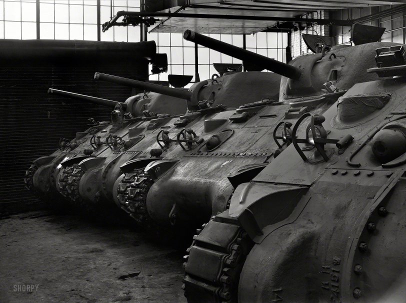 January 1943. "New M-4 tanks, which will soon be hurling their might against the Axis, in the Schenectady, New York, plant of the American Locomotive Company." Photo by Howard Hollem for the Office of War Information. View full size.
