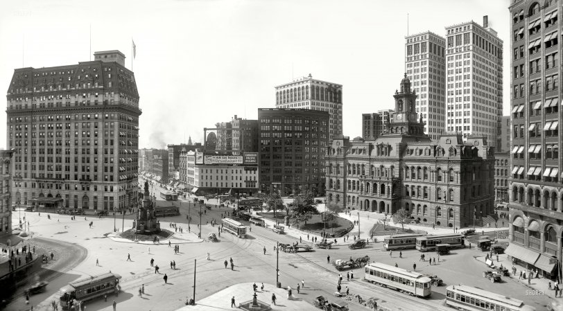 Detroit circa 1915. "Woodward Avenue and Campus Martius." Among the Motown landmarks in this panorama of two 8x10 glass negatives are the Hotel Pontchartrain, Soldiers' & Sailors' Monument, Ford Building, Detroit City Hall and Dime Savings Bank. Detroit Publishing Company. View full size.