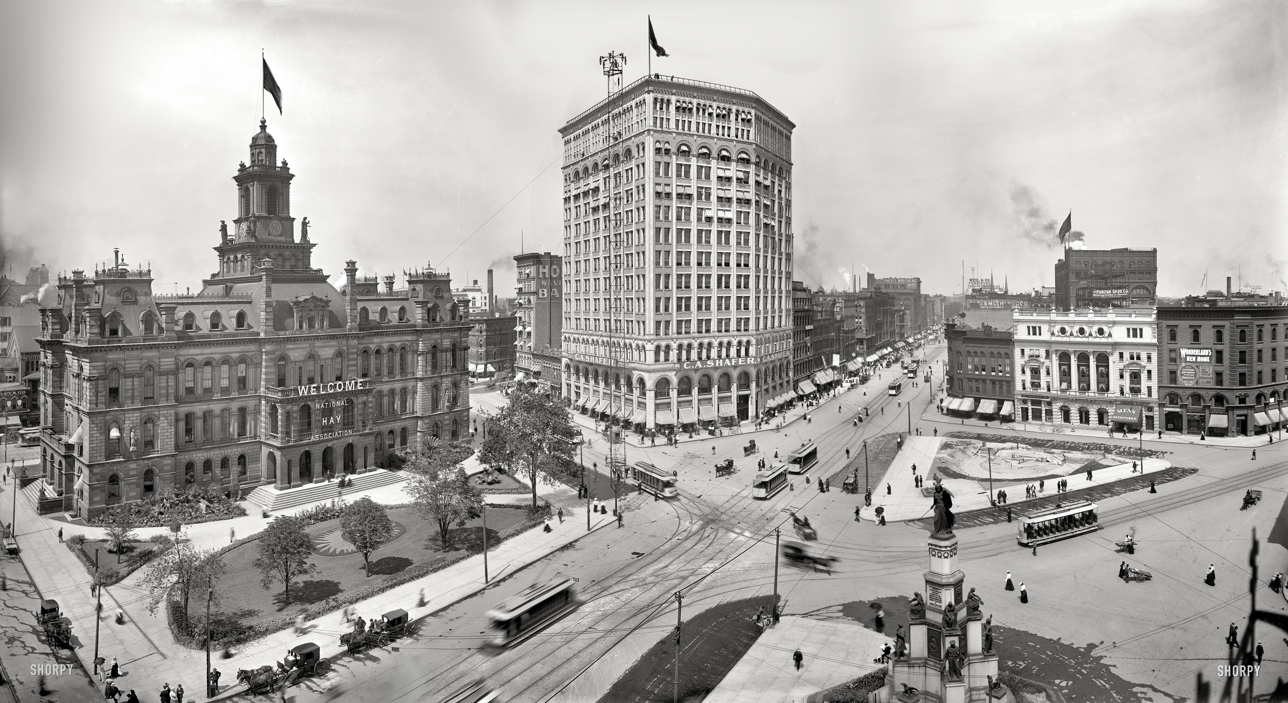 Detroit circa 1900. "Campus Martius and City Hall." Other landmarks in this panorama of three 8x10 glass negatives include the Soldiers and Sailors Monument, Detroit Opera House and the Majestic Building; also note the National Hay Association sign and "moonlight tower" arc lamp. View full size.