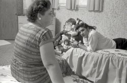 1956. Continuing the Shorpy Mother's Day tribute: A young Elvis Presley at home in Memphis with mom Gladys, and an impressive assortment of stuffed animals. 35mm negative by Phillip Harrington for Look magazine. View full size.