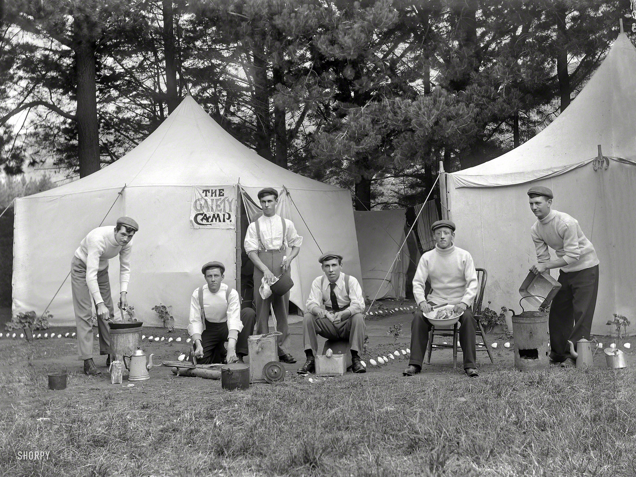 New Zealand circa 1910. "Group men outside a tent with a sign reading 'The Gaiety Camp,' showing each man performing domestic duties. Probably Christchurch district." It would be interesting to know something about the history of these elaborate camps (note the geranium flower beds), and how long the custom lasted. Photo by Adam Maclay, who made hundreds of these portraits. View full size.