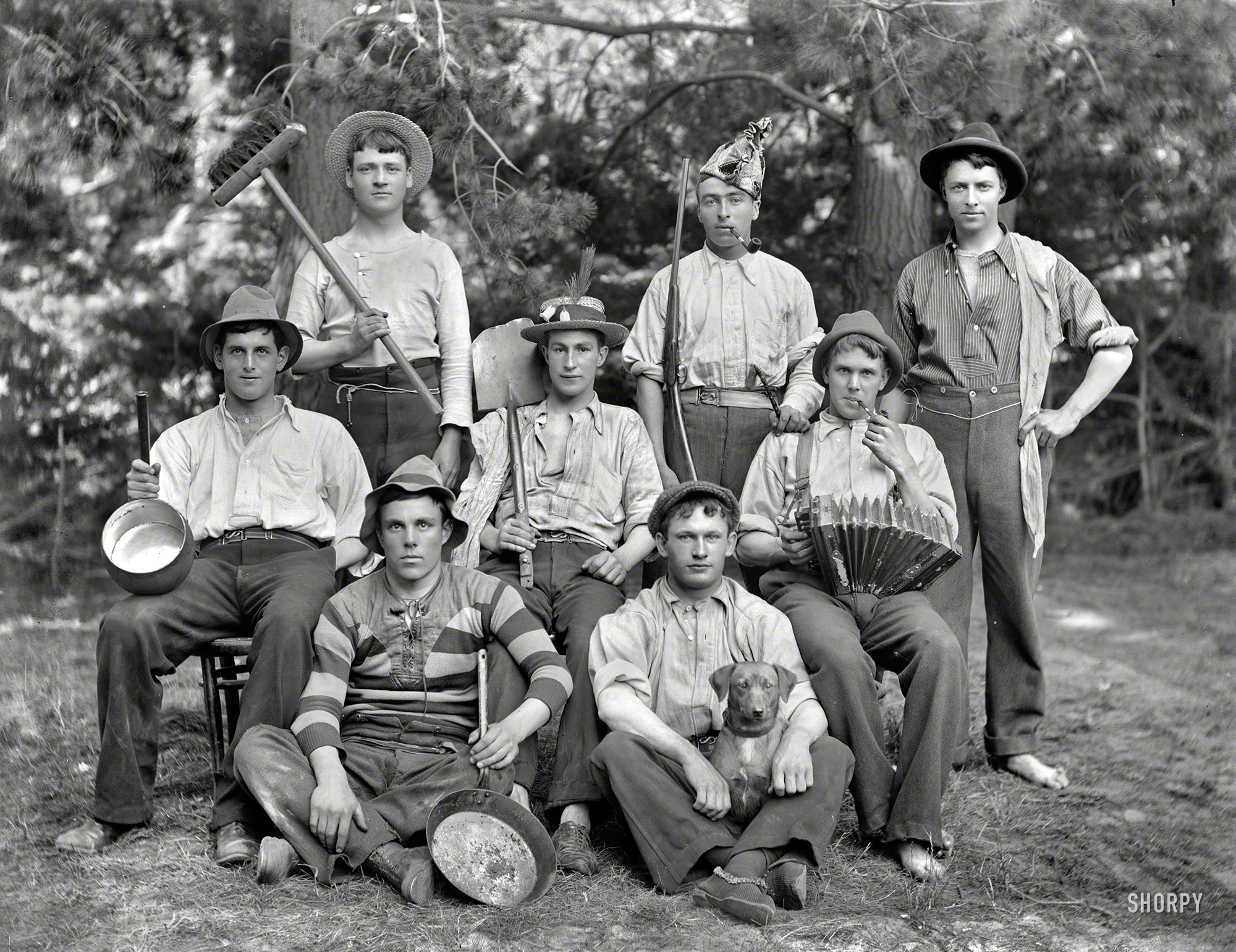 New Zealand circa 1905. "Eight young men in ragtag clothing with hats, pots, broom, shovel, accordion, pipes, gun and dog. Sumner, Christchurch." Five of these fun-loving hayseeds are the Myrtle Campers from this post. Glass negative by Adam Maclay, Alexander Turnbull Library. View full size.
