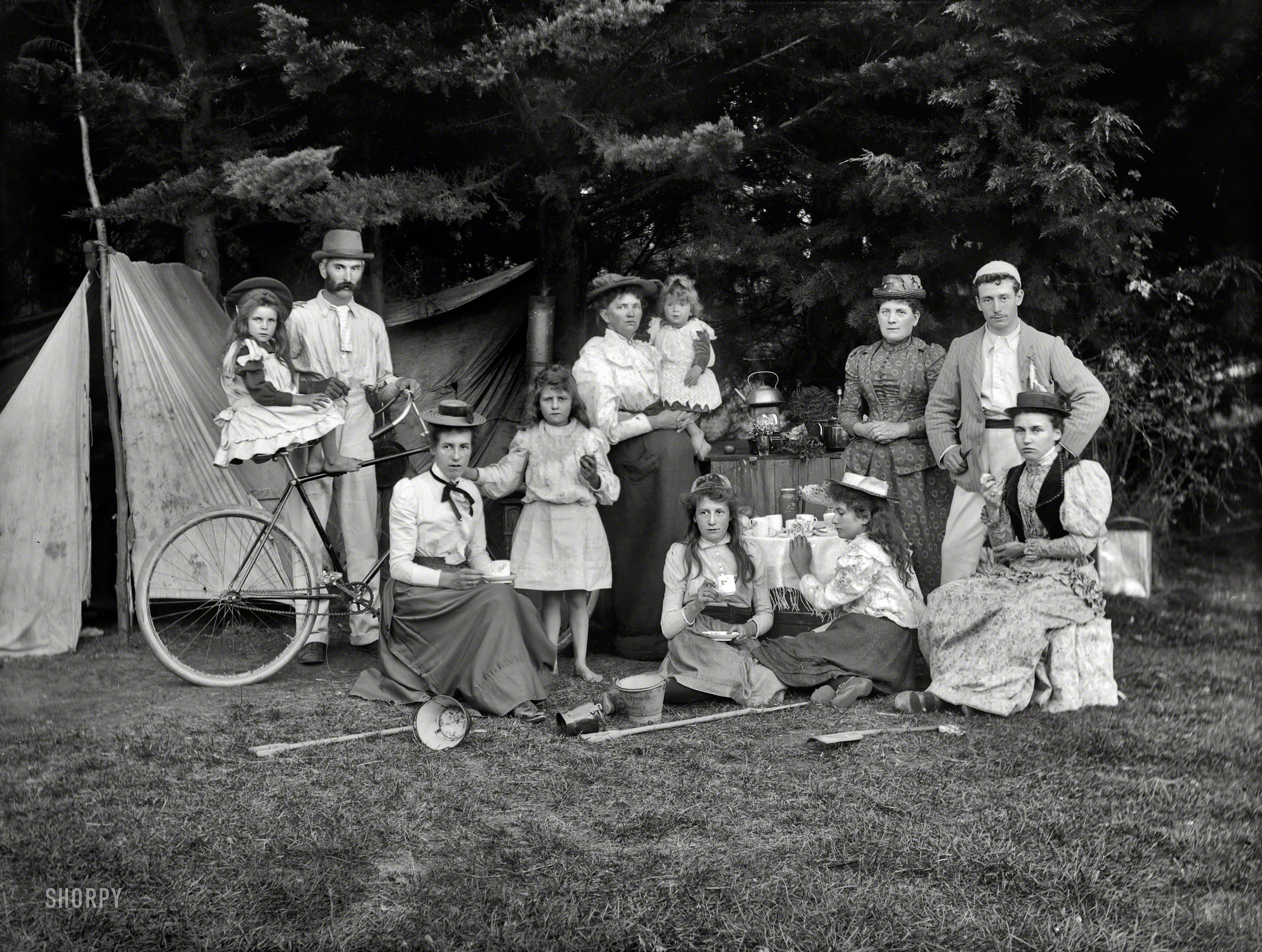 New Zealand circa 1910. "Unidentified group outside a tent, possibly at Sumner, Christchurch." Glass negative by Adam Maclay. View full size.